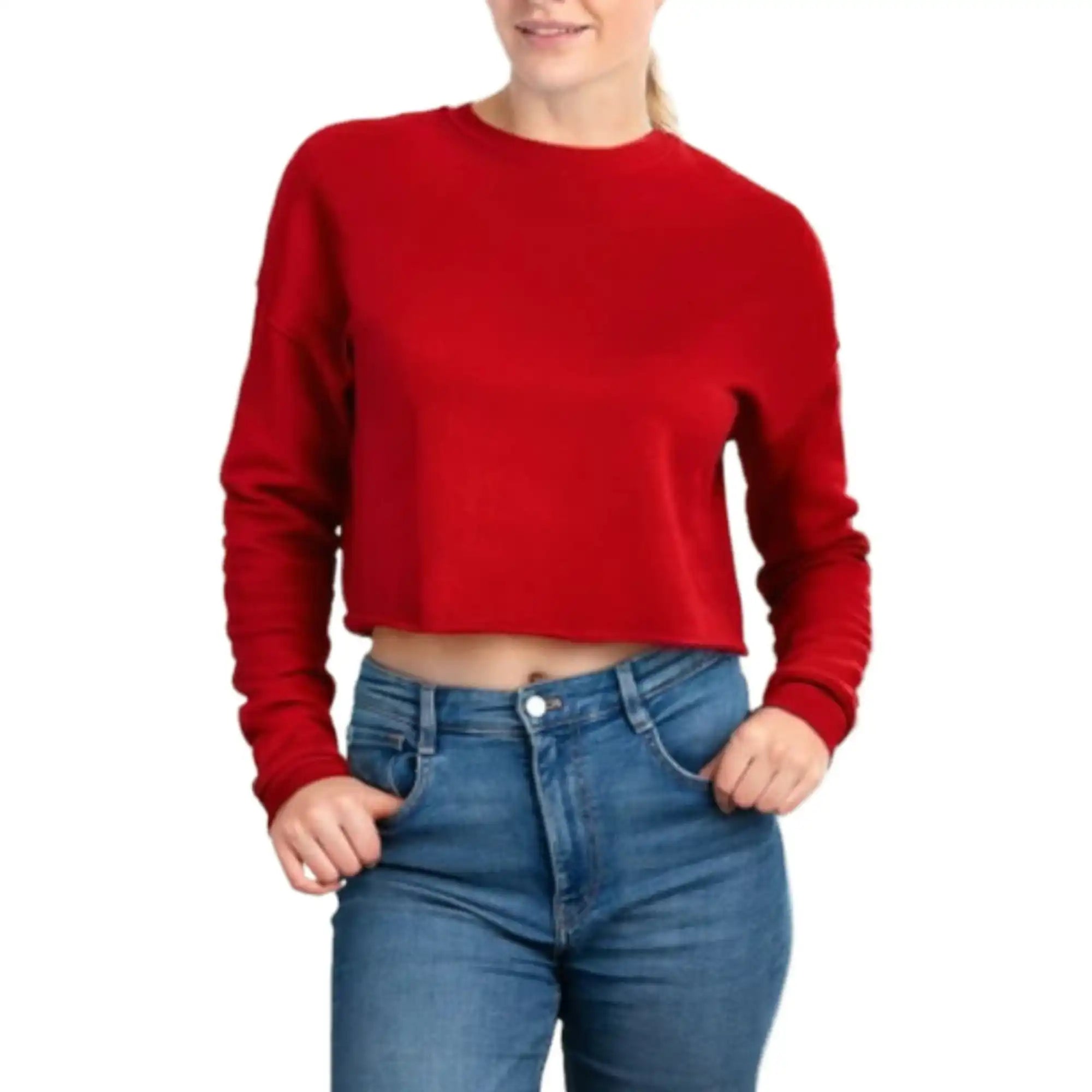 Red cropped sweatshirt with blue jeans.